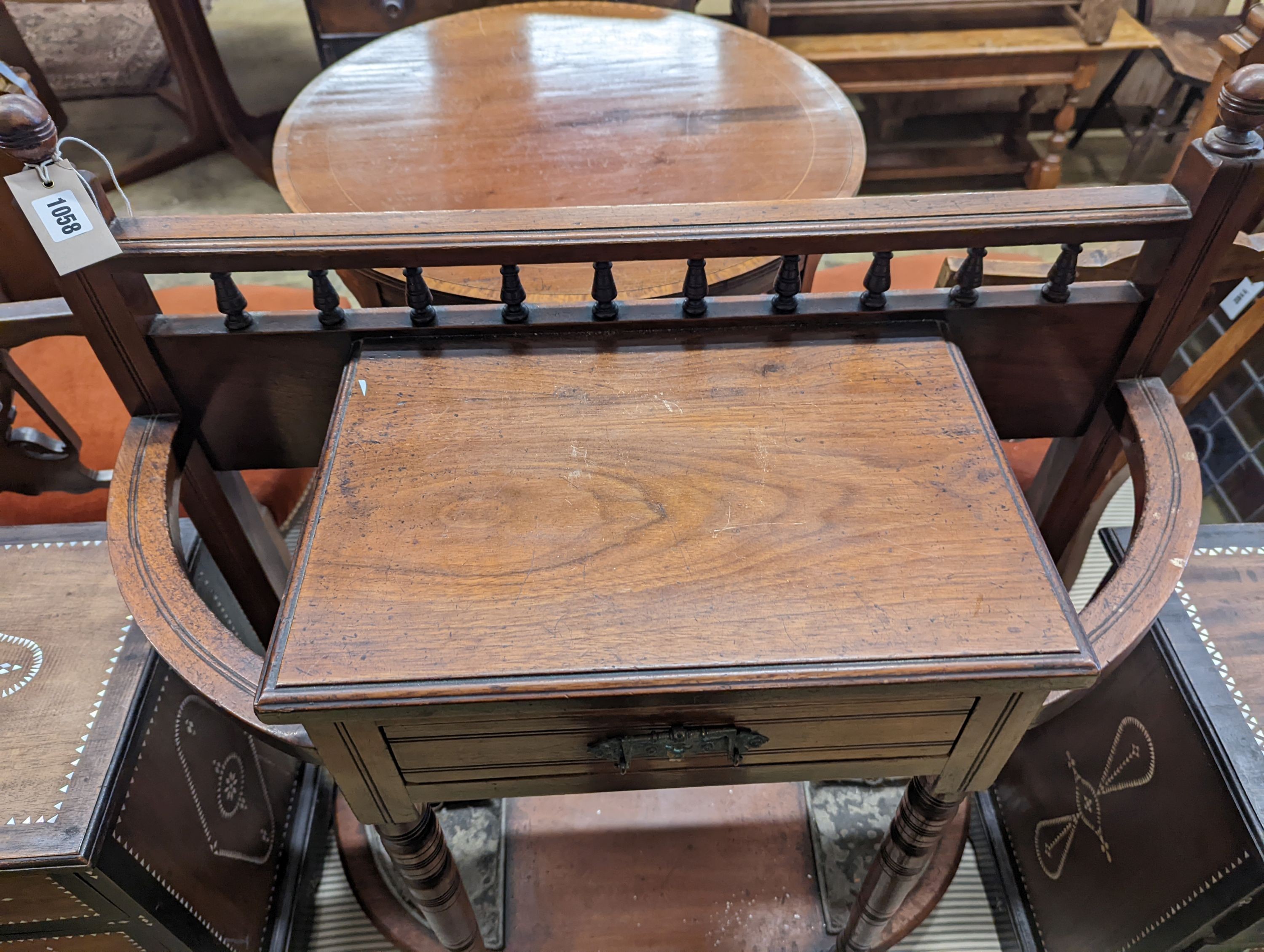 A late Victorian walnut stick stand, length 77cm, depth 31cm, height 94cm